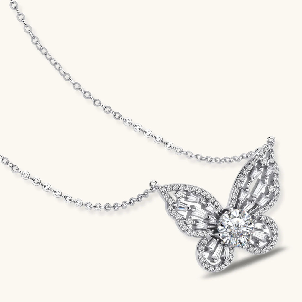 Sterling silver butterfly pendant with radiating design and central moissanite stone on adjustable chain