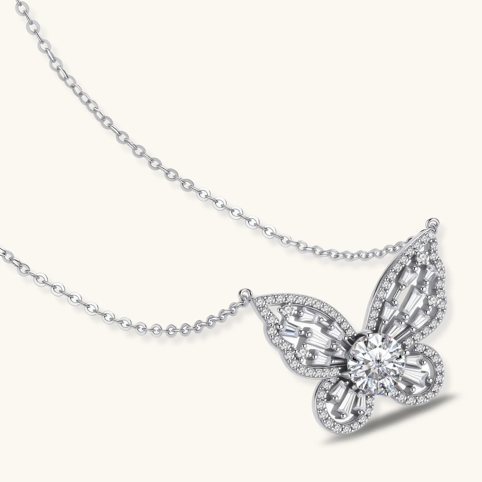 Sterling silver butterfly pendant with radiating design and central moissanite stone on adjustable chain