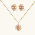 Ornate gold-plated jewelry set featuring peach center stone surrounded by clear AAA cubic zirconia crystals