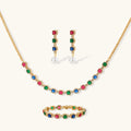 Gold-plated jewelry set with red, green, and blue cubic zirconia stones including necklace, bracelet, and drop earrings.
