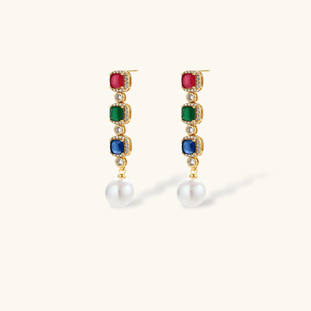 Gold-plated jewelry set with red, green, and blue cubic zirconia stones including necklace, bracelet, and drop earrings.