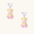 Pastel gradient teddy bear drop earrings with clear heart studs and pearl details on white background.