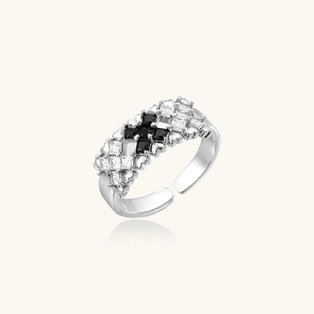 Adjustable white gold plated ring with geometric grid of black and clear zirconia stones in checkerboard pattern