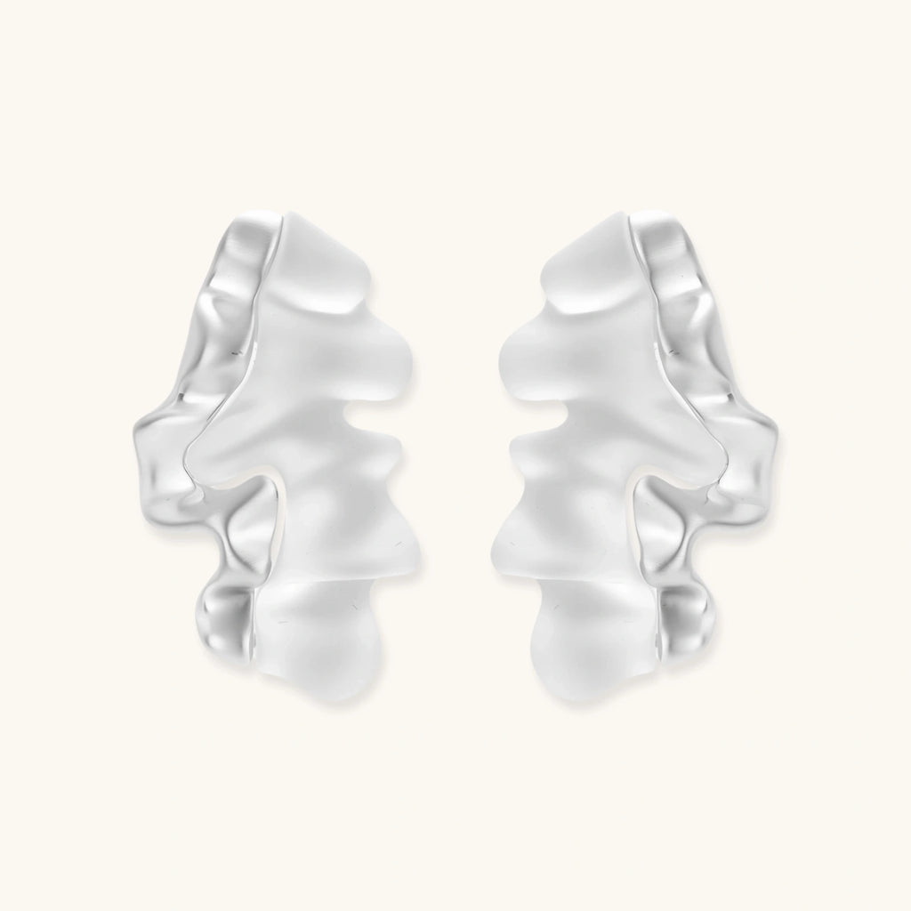 Modern sculptural jewelry set with flowing ribbon-like earrings and matching pendant in eco-zinc alloy finish