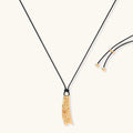 Curved textured pendant necklace on black adjustable cord with metallic finish in gold or silver
