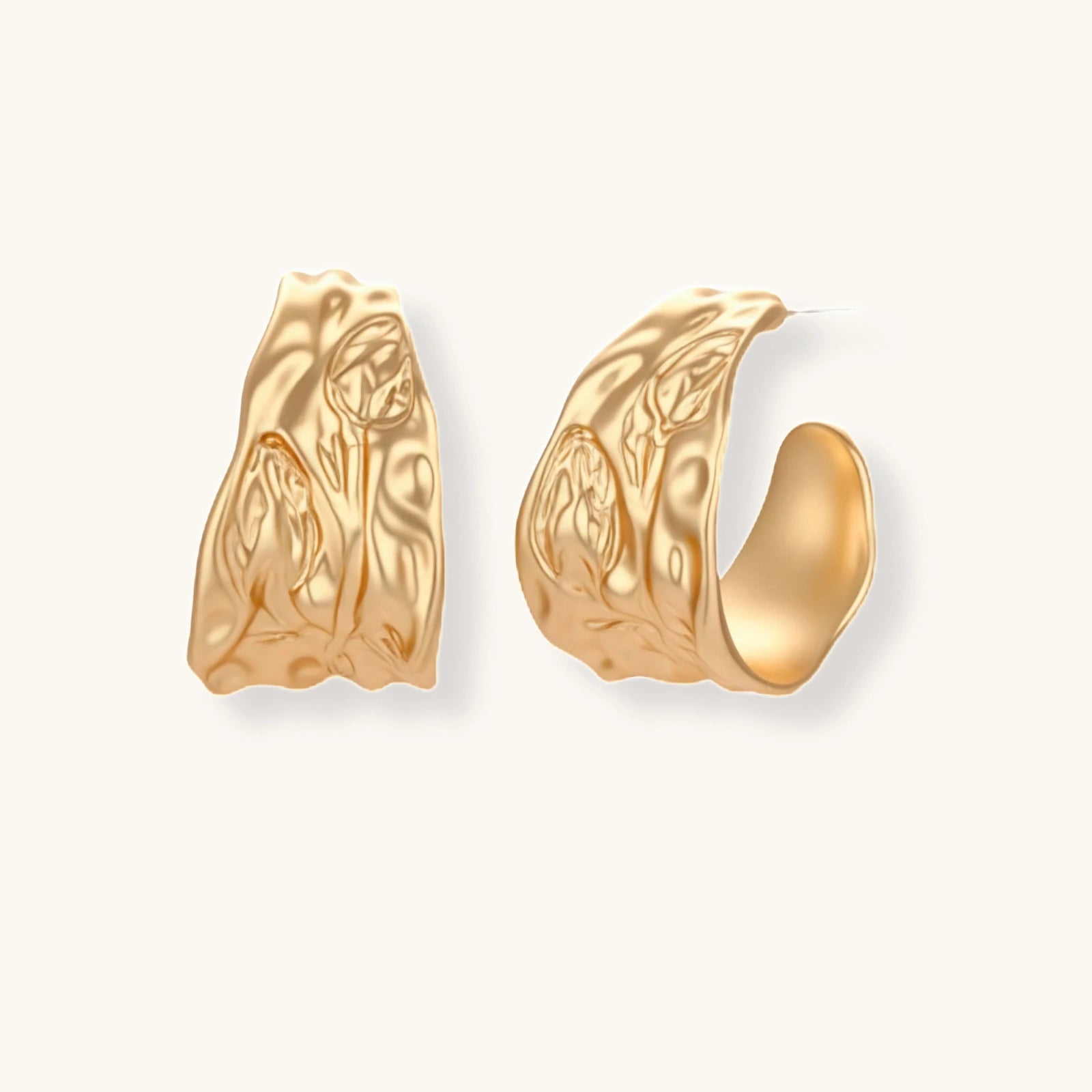 Close-up of textured hoop earrings with liquid metal ripple pattern in eco-zinc alloy with sterling silver posts.