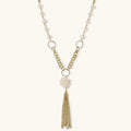 Long gold-plated necklace with freshwater pearls, chunky chain links, and flowing tassel pendant