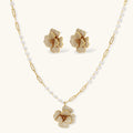 14K gold-plated flower jewelry set with zirconia crystals, featuring dimensional petal necklace and matching earrings
