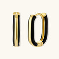 Modern hoop earrings with gold-plated and black sections, featuring hinged closure on white background.