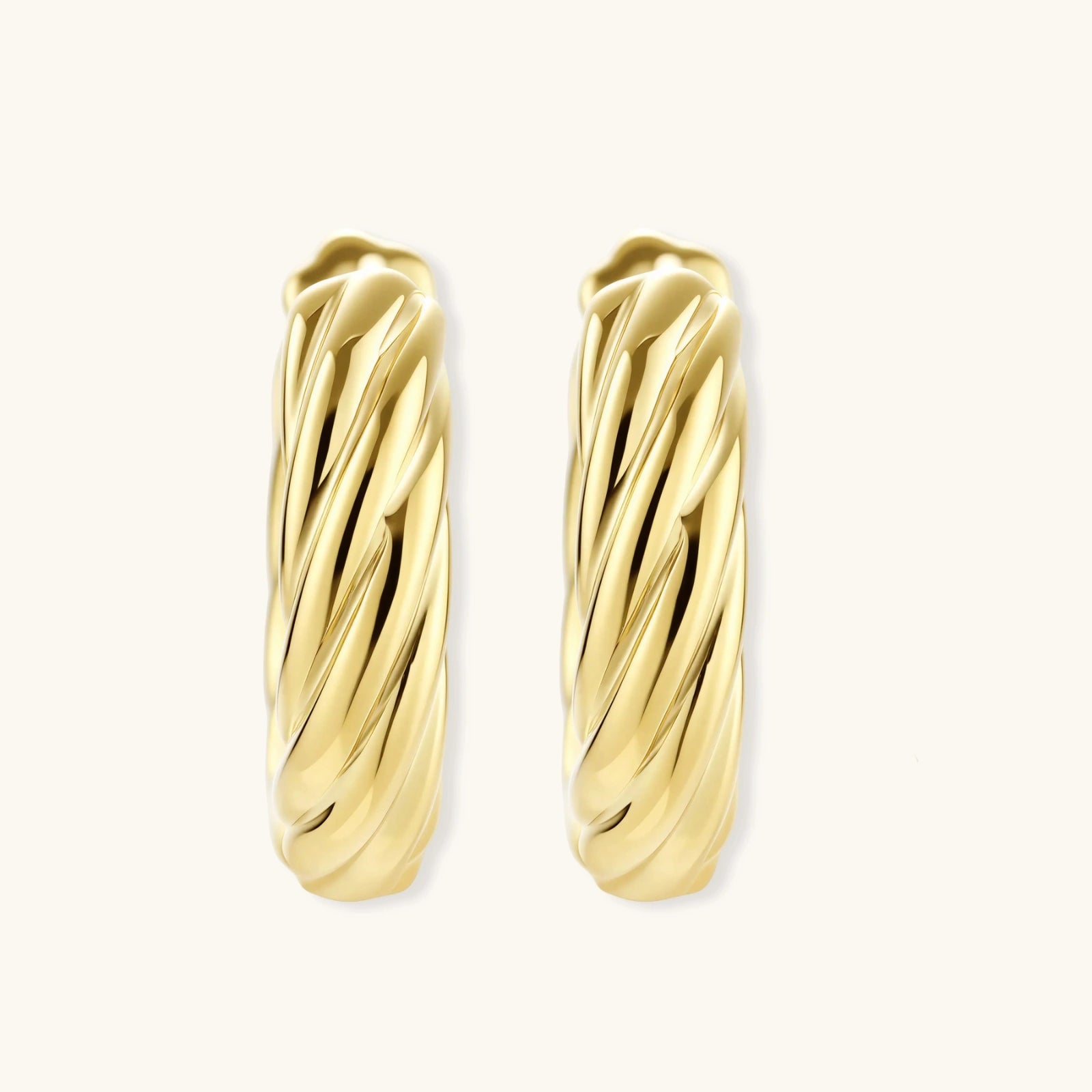 14K gold-plated twisted rope huggie hoop earrings with hinged closure on white background, showing textured surface detail