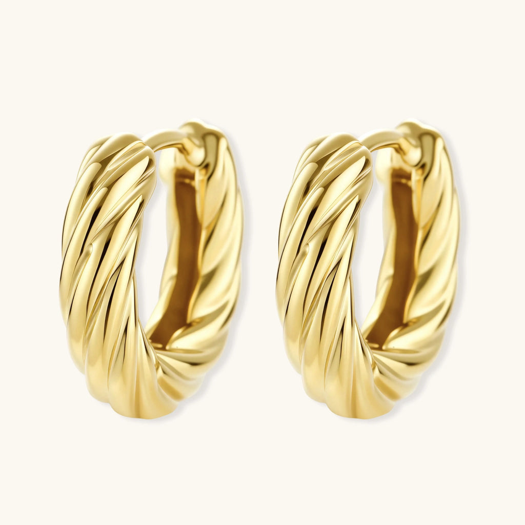 14K gold-plated twisted rope huggie hoop earrings with hinged closure on white background, showing textured surface detail