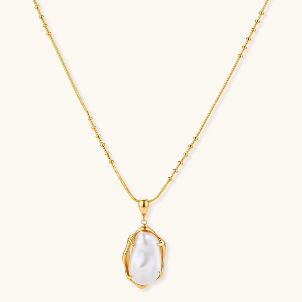18K gold-plated sterling silver necklace with alternating bead chain and baroque pearl pendant on neutral background.