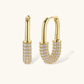 Gold-plated huggie hoop earrings with pavé zirconia stones covering the bottom curve, shown in open and closed positions.