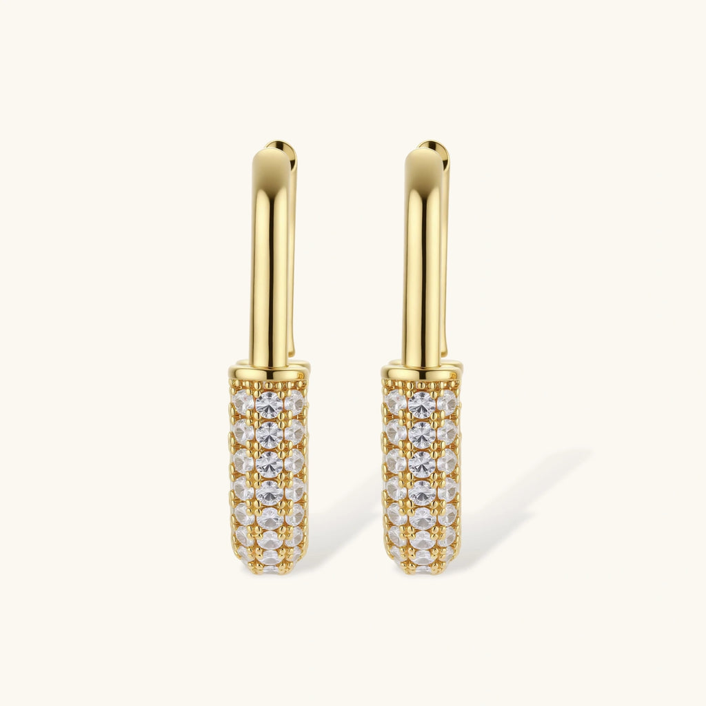 Gold-plated huggie hoop earrings with pavé zirconia stones covering the bottom curve, shown in open and closed positions.
