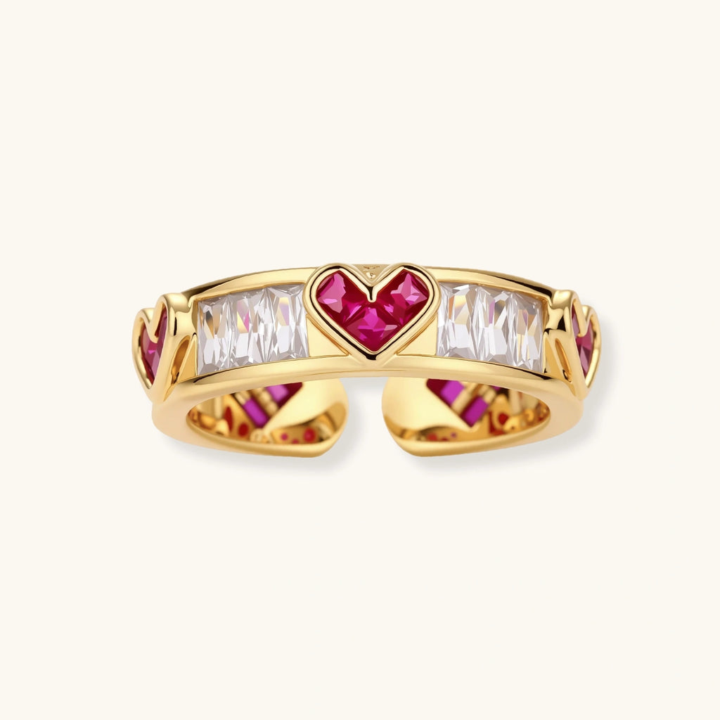 Gold-plated adjustable ring with alternating red heart-shaped and clear rectangular zirconia stones in geometric pattern
