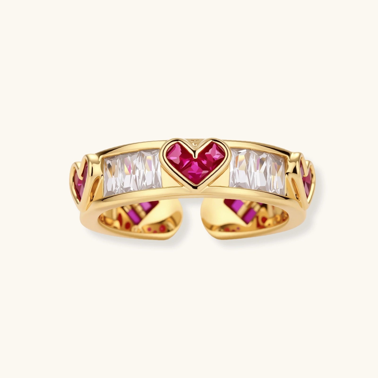 Gold-plated adjustable ring with alternating red heart-shaped and clear rectangular zirconia stones in geometric pattern