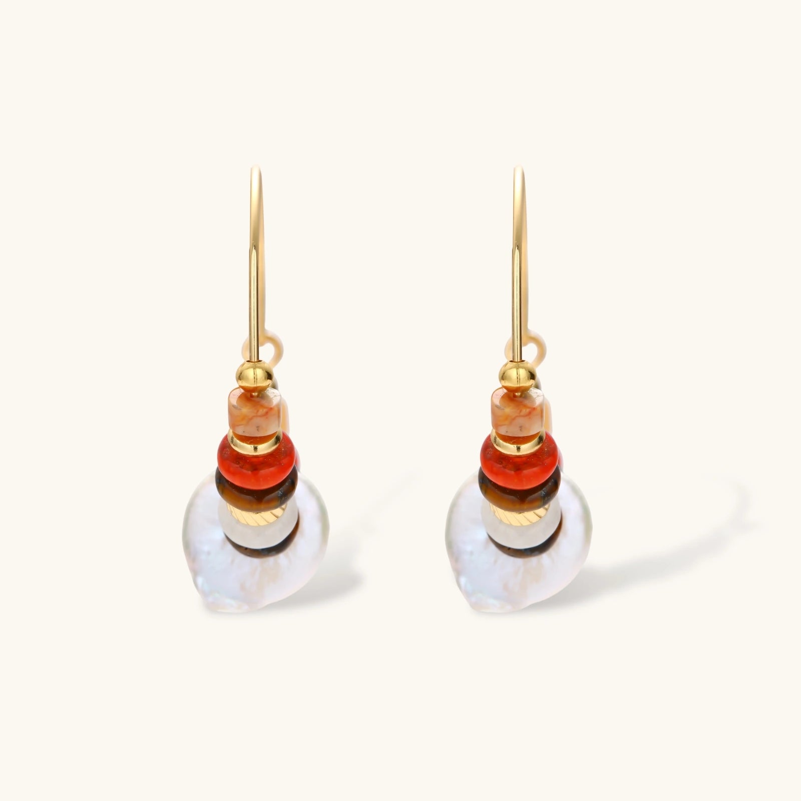 18k gold-plated earrings featuring baroque pearls and colorful natural stones in a stacked design on cream background.
