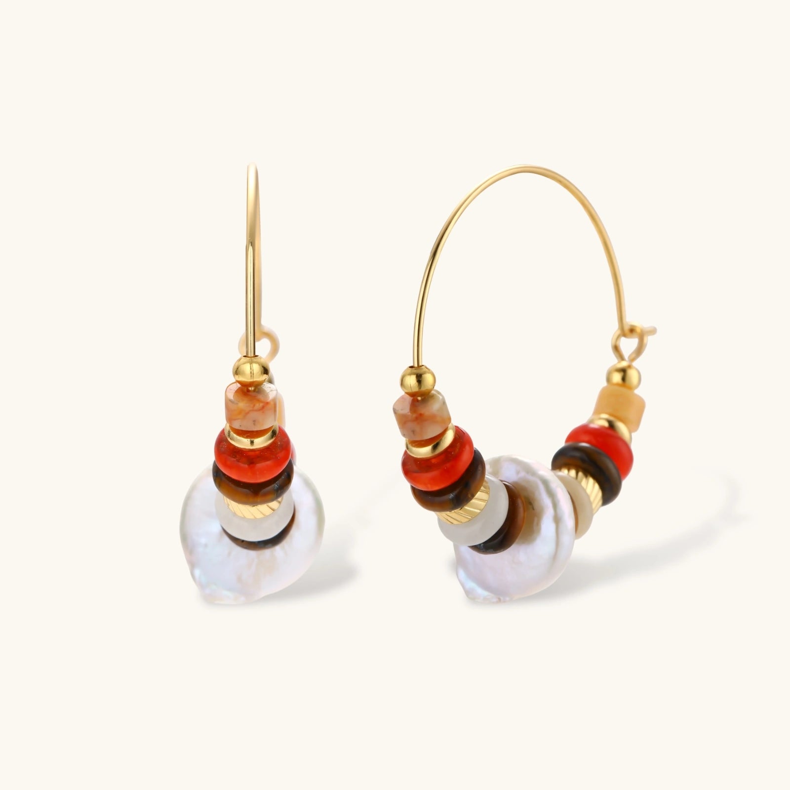 18k gold-plated earrings featuring baroque pearls and colorful natural stones in a stacked design on cream background.