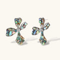 Cross-shaped stud earrings with iridescent abalone shell mosaic in blues and greens, silver-plated setting with crystal center