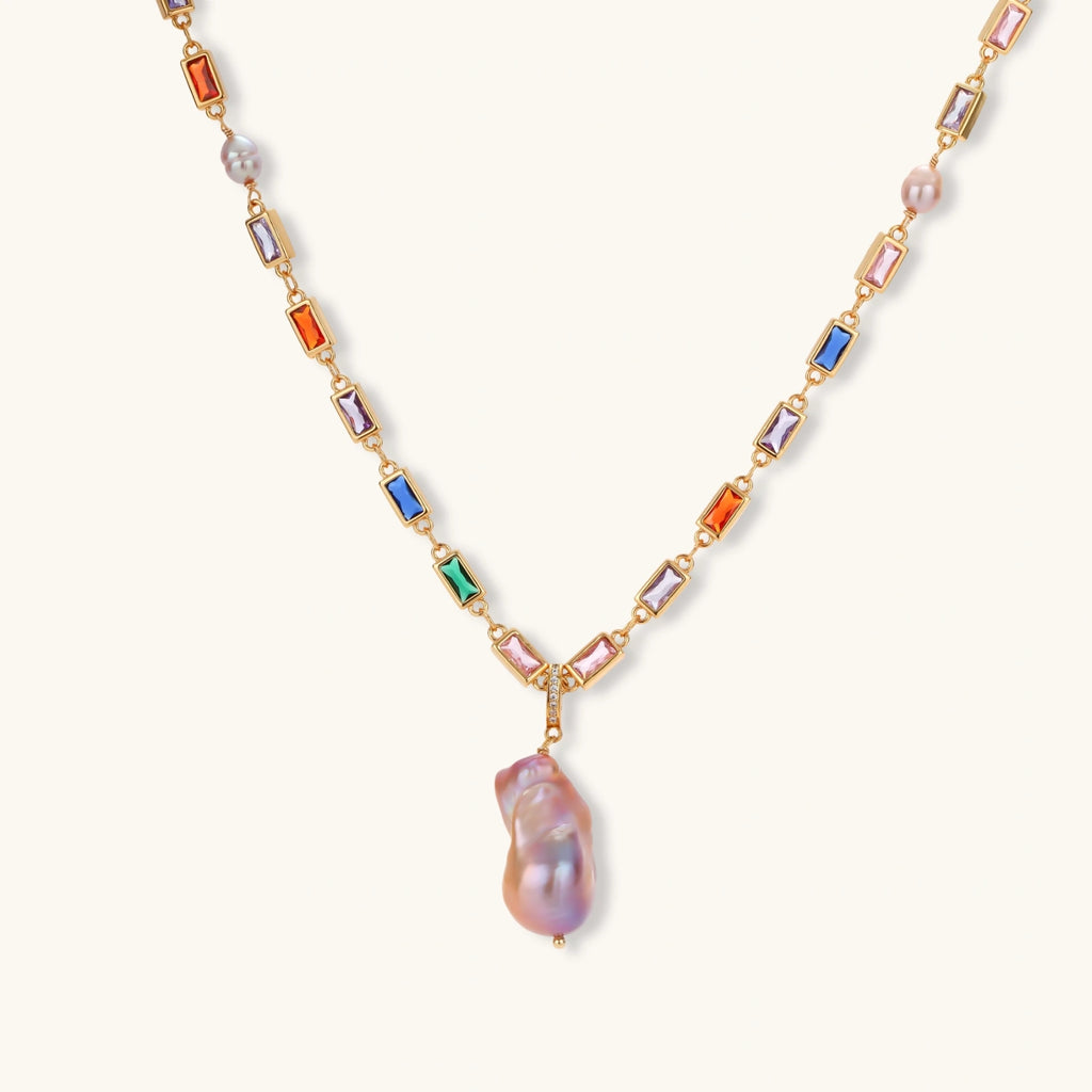 Colorful statement necklace with rainbow zircon stones and iridescent baroque pearl pendant on gold-plated chain