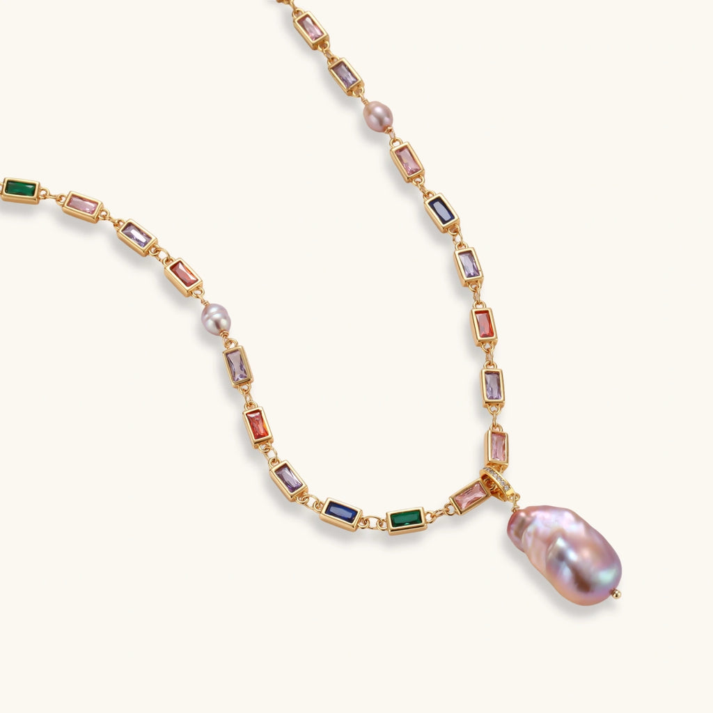 Colorful statement necklace with rainbow zircon stones and iridescent baroque pearl pendant on gold-plated chain