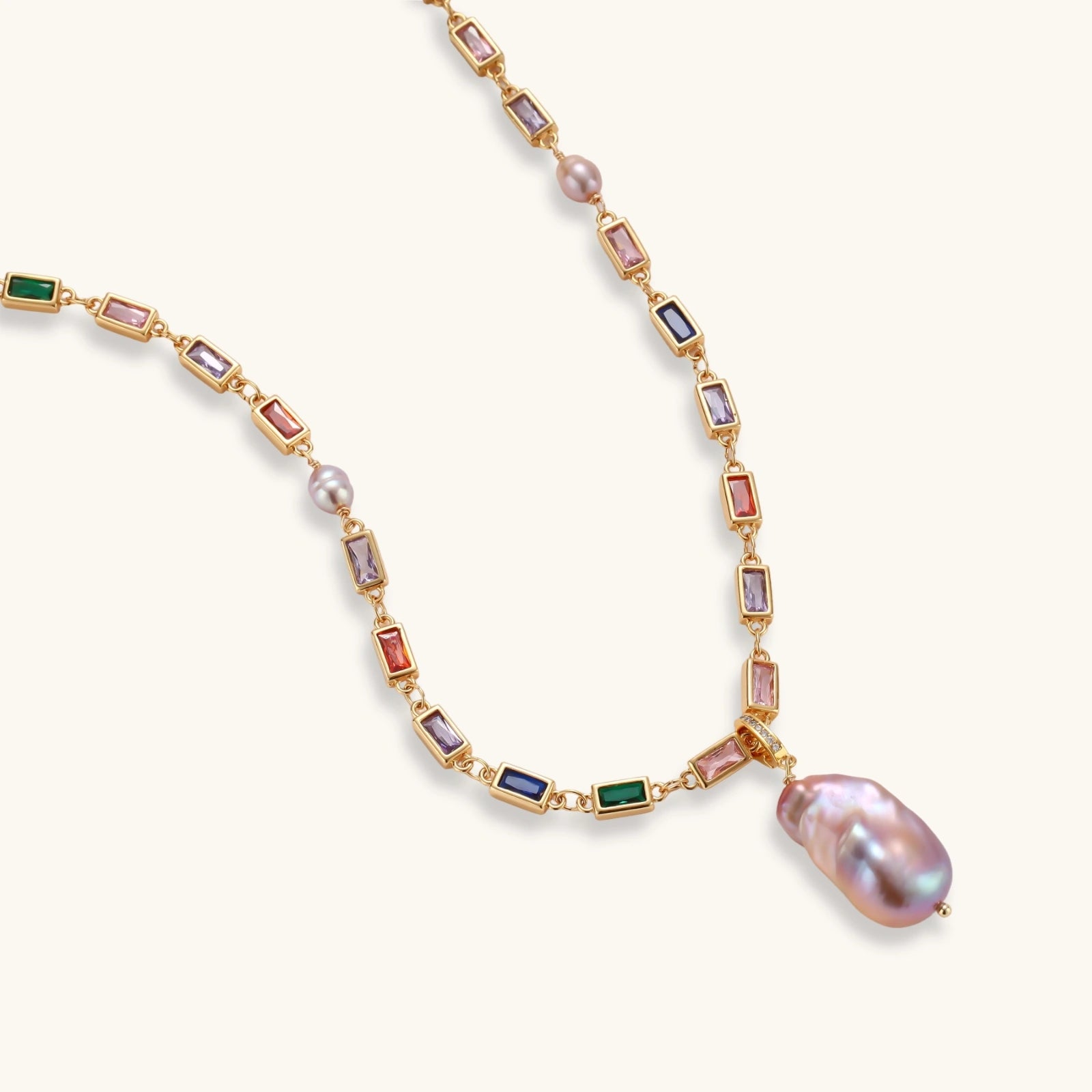 Colorful statement necklace with rainbow zircon stones and iridescent baroque pearl pendant on gold-plated chain